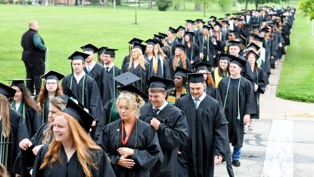 Students walking down path to commencement